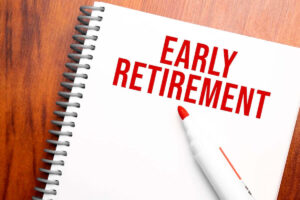 'early retirement' written in red on a notepad