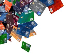 Numerous credit cards spread out against a white background