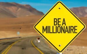 Yellow road sign that reads 'be a millionaire'